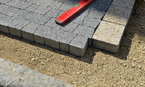 Level gauge applied at stone blocks laying