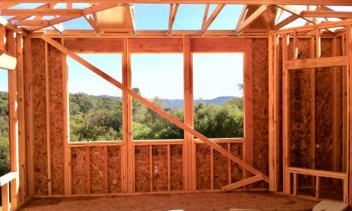 Framed view windows and fireplace in family room