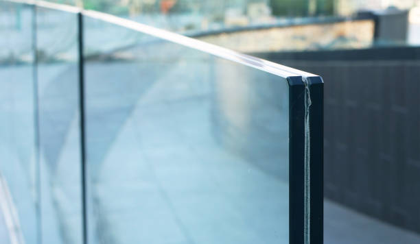 Frameless laminated glass railing exterior installation.